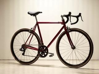 A meticulously restored vintage lugged track bike, showcasing classic details.